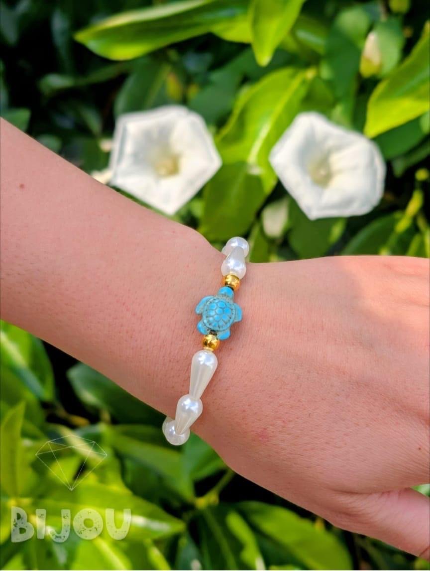 Pearls and gold beads with turquoise turtle charm